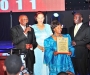 Mr & Mrs Alibaruho recive the awardon behalf of their son Kwatsi Alibaruho, the first African American to command a space mission, at the Diaspora Dinner held at the Serena Victoria Ballroom on Thursday. PHOTO BY KALUNGI KABUYE