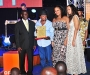 Relatives of Derreck Kayongo collect his award on his behalf at the Diaspora Dinner held at the Serena Victoria Ballroom on Thursday. PHOTO BY KALUNGI KABUYE