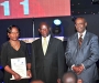 Munini Mulera, right, and his wife, lefy, pose for a picture with the Vice President Edward Sekandi at the Diaspora Dinner held at the Serena Victoria Ballroom on Thursday. PHOTO BY KALUNGI KABUYE